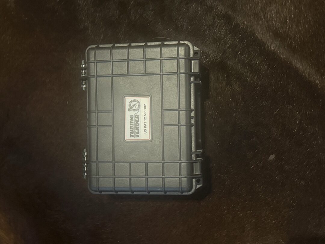 Tubing Tender rugged case closed, showing the Tubing Tender brand label and US Patent number